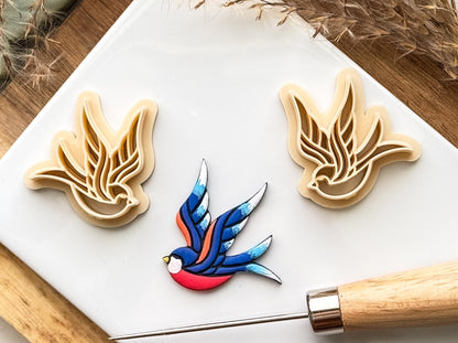 Beige mirrored pair of sparrow bird clay cutters