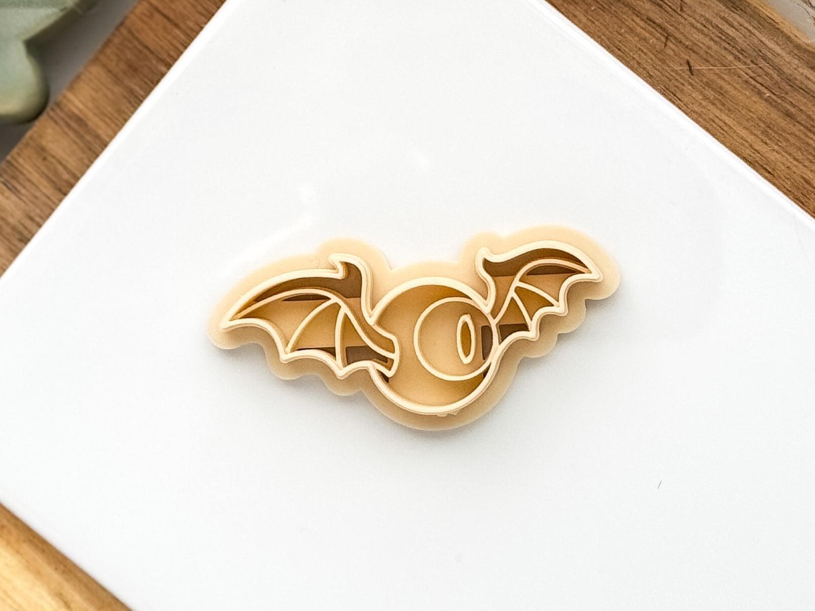 Beige eyeball with wings clay cutter
