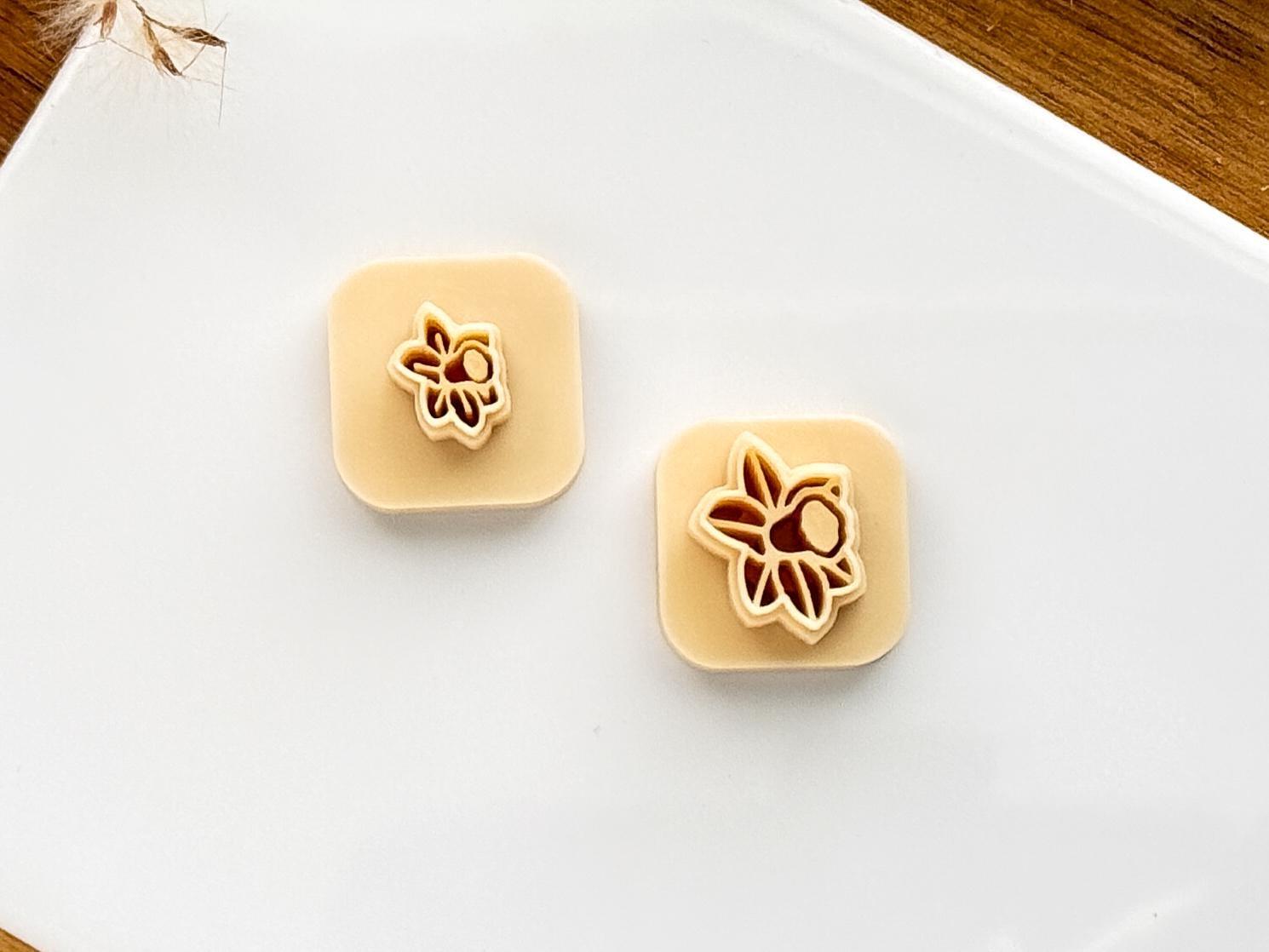 Set of two small spring flower clay cutters with stamp lines.