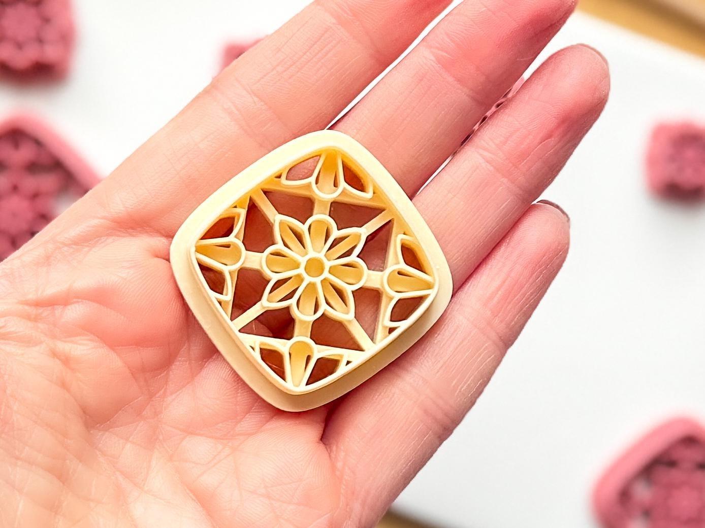 Image showing beige version of the large floral earring cutter for clay in square shape.
