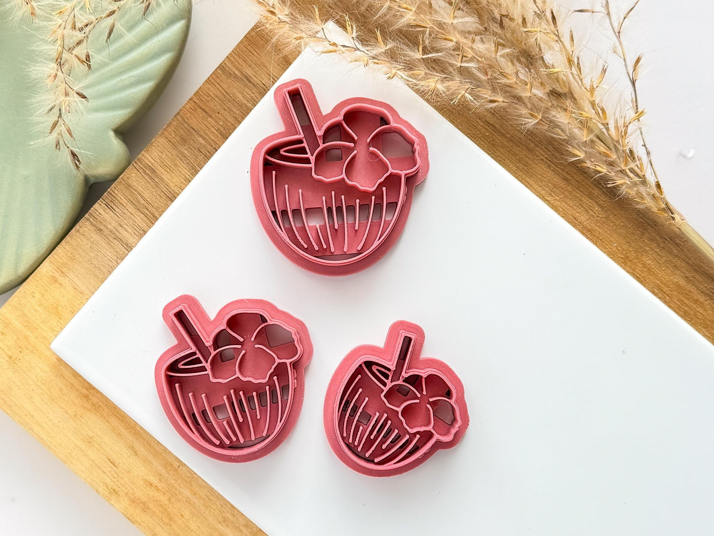 various sizes of coconut drink polymer clay cutters in pink