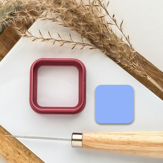 Square shaped clay cutter with rounded corners in dark pink