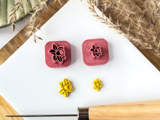 Daffodil flower mini clay cutter set with yellow sample polymer clay cut out pieces and inprint lines.