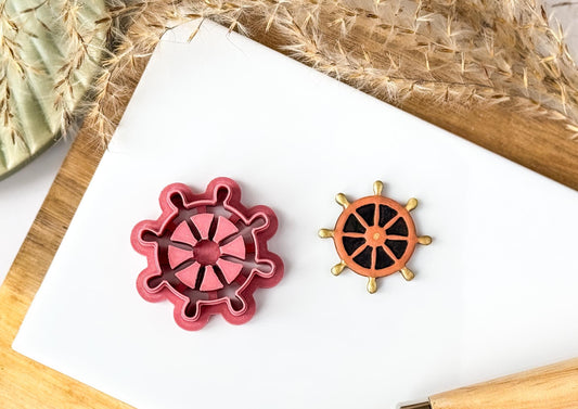Ships wheel helm shaped polymer clay cutter with painted sample piece