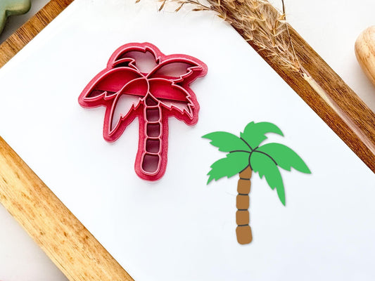 Palm tree shaped clay cutter with swaying leaves, secntioned trunk and paintable imprint lines.