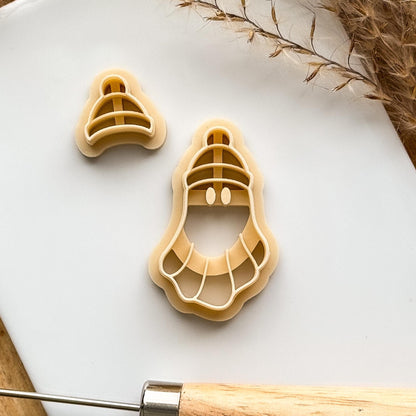 beige coloured ghost clay cutter with bobble hat