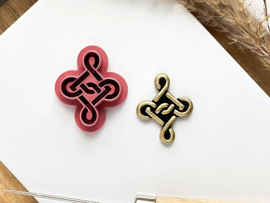 Celtic knot shaped clay cutter with deep imprint sections to create a raised rope effect