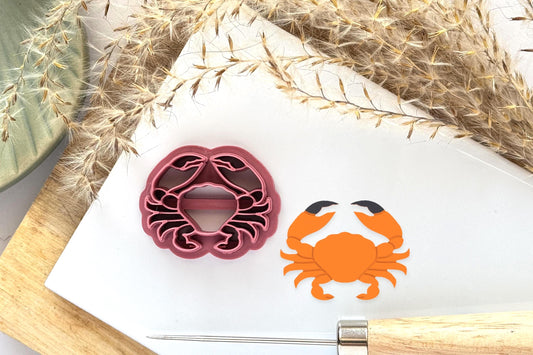 Whole crab polymer clay cutter with legs and large pincers along side a sample using simulated 2.5mm deep clay
