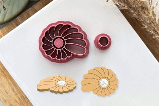 Spiral seashell shaped clay cutter with deep center impression for faux gemstone