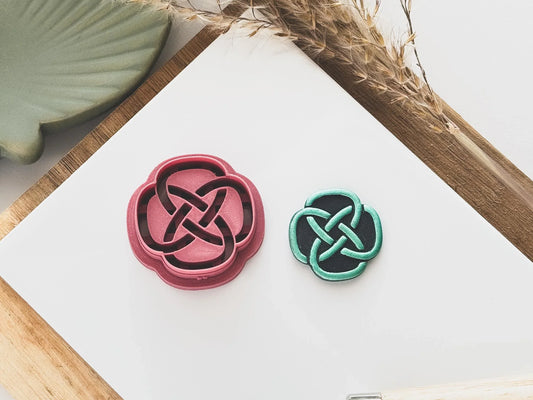 Circular Celtic Knot shaped polymer clay cutter with sample clay piece showing embossed sections.