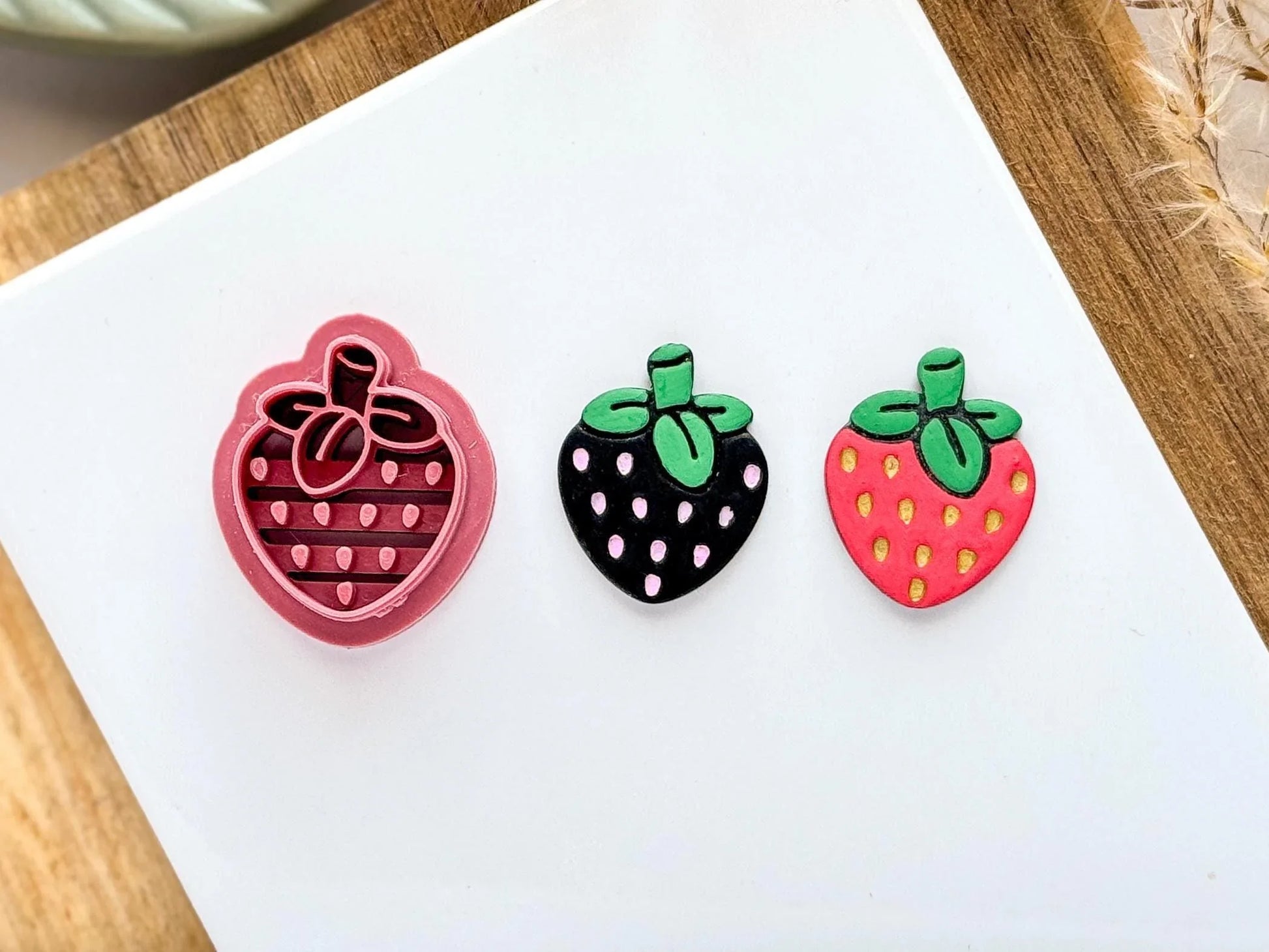 Strawberry shaped clay cutter with leaf, stem and pips stamp detail