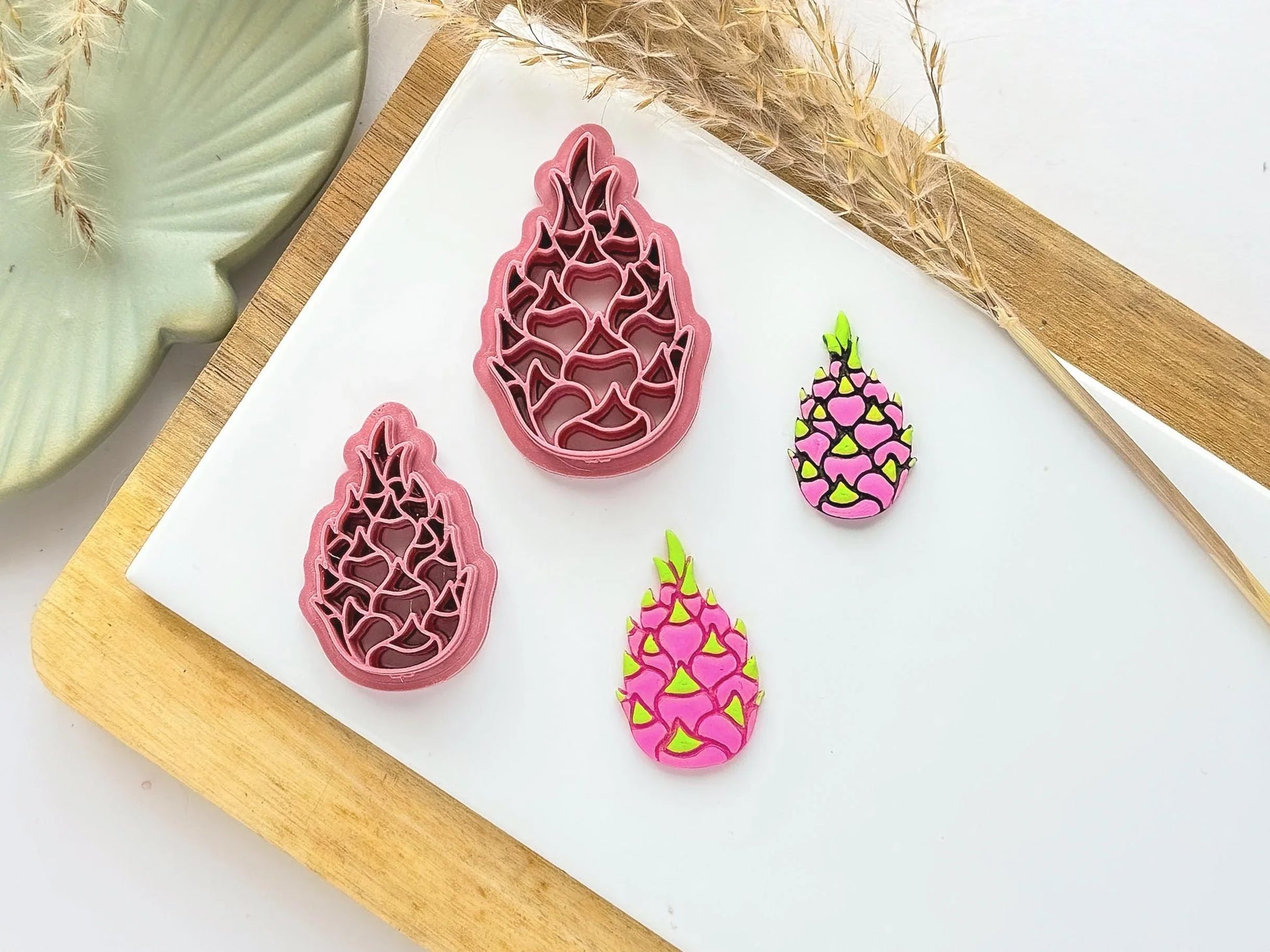 Tropical dragonfruit shaped clay cutter with pink and green polymer clay samples