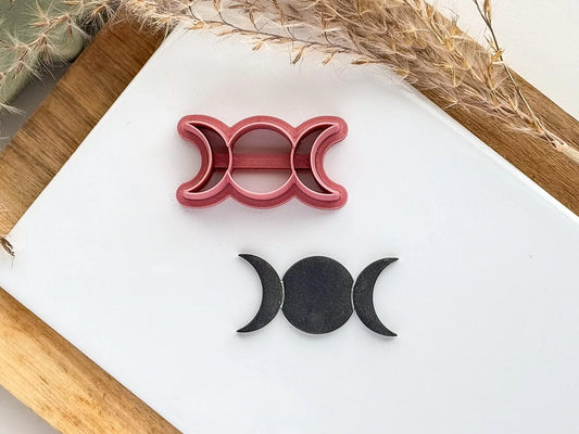 Triple goddess pagain symbol clay cutter in dark pink with black polymer clay cut out shape