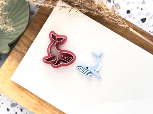 3d printed blue whale shaped clay cutter in pink pla+ with sample cut out in fimo polymer clay painted with acrylic posca pens