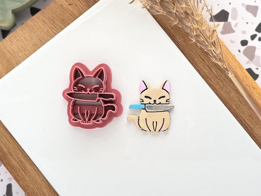 cat shaped cutter with knife details, halloween themed.