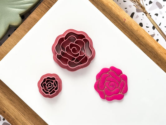 Open rose flower shaped polymer clay cutters with pink rose cut out sample.
