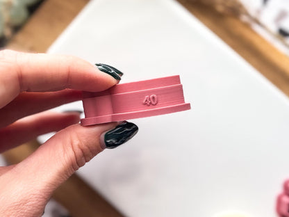 Side view of a boho themed bird clay earring cutter.