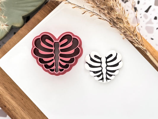 Halloween themed rib cage shaped debossing cutter with polymer clay cut out sample piece