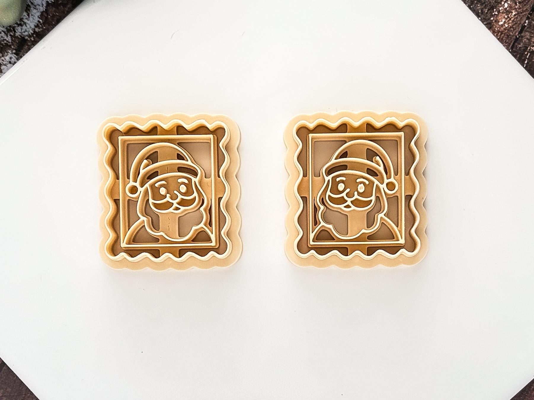 Beige Mirrored Santa Stamp Clay Cutter Set on a White Tile