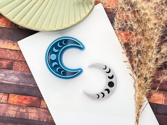 Crescent moon shaped polymer clay cutter with moon phase imprint stamp details