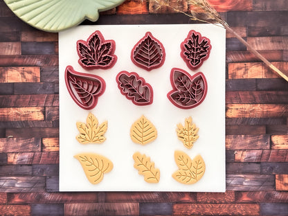 Fabled cutters leaf shaped clay cutters on a white tile with polymer clay sample pieces