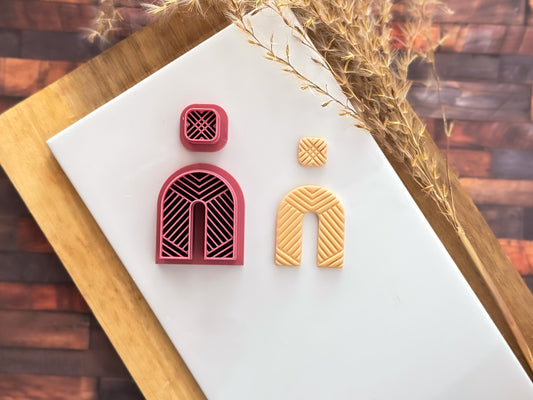 Arch cutter set for making clay earrings, large arch and small square shape with herringbone style impression lines.