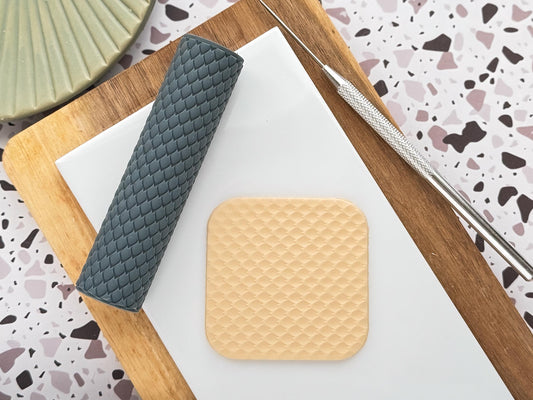 Dragon skin texture roller with polymer clay sample