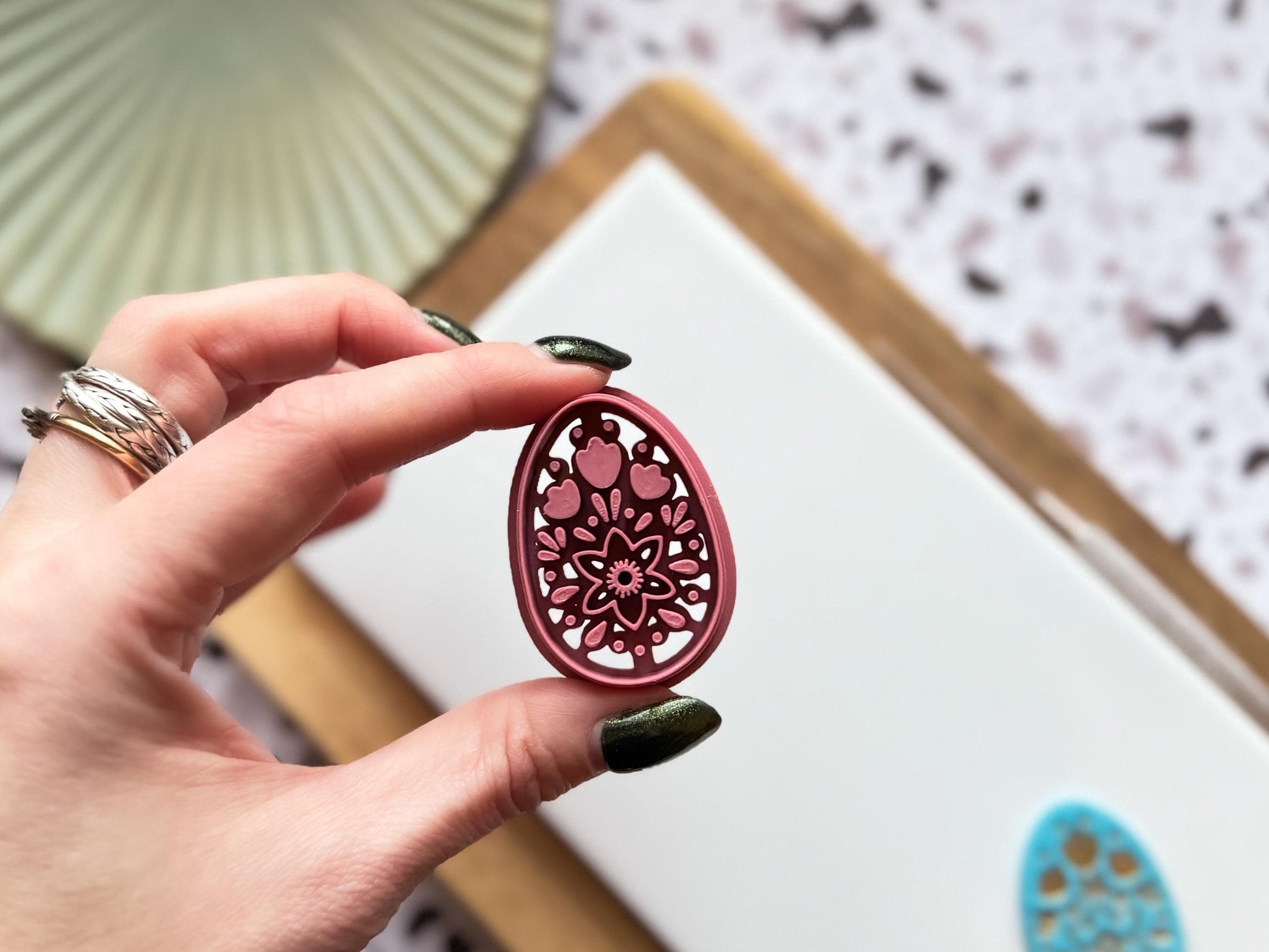 Close up of boho egg cutter tool for polymer clay and fondant showing open back for air flow.