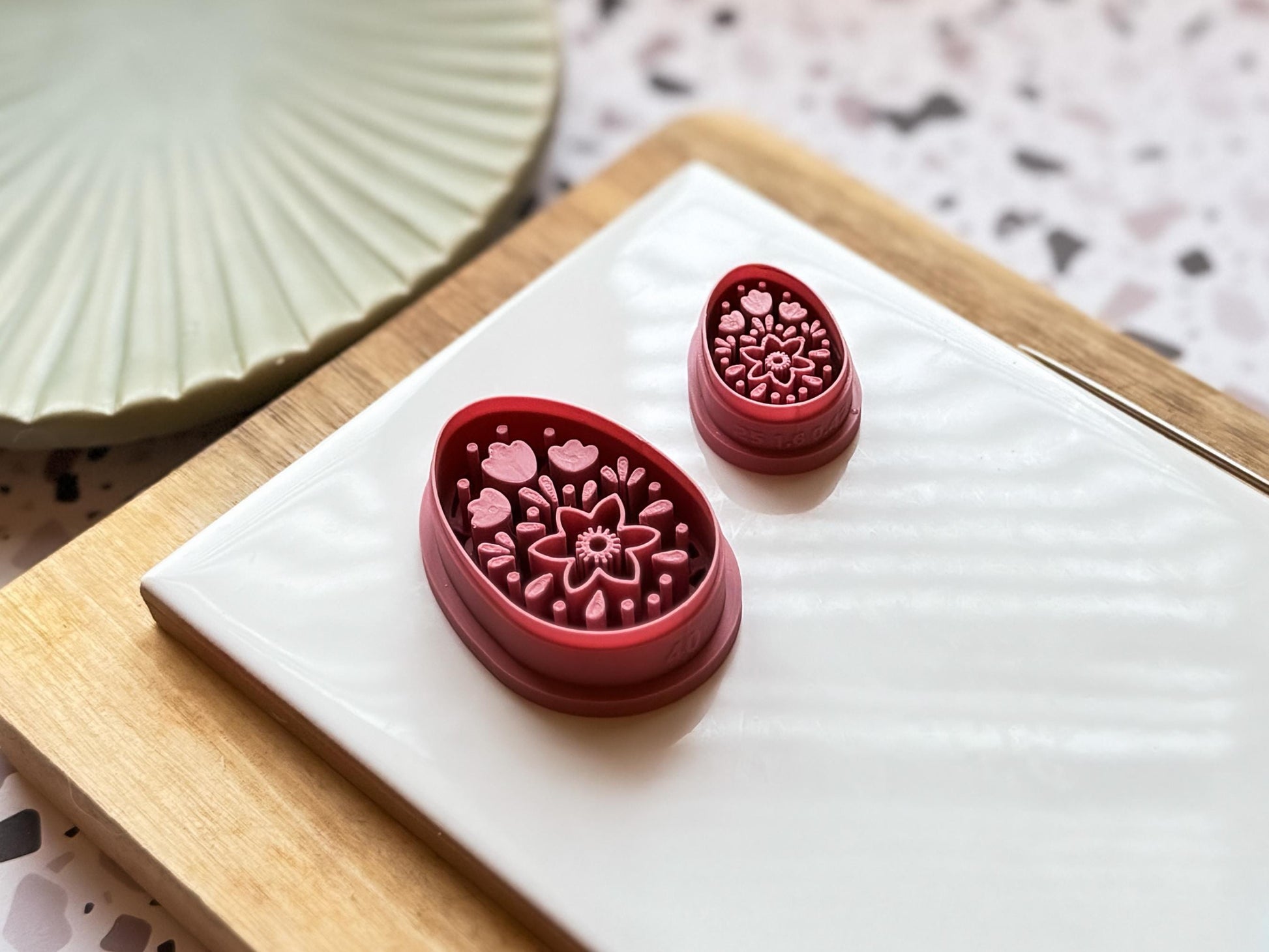 side view of small and large egg shaped boho themed cutter to show clay stamp depth