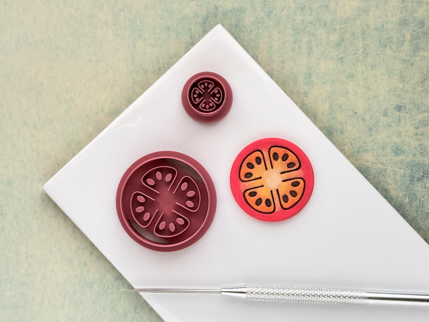 Tomato slice clay cutter showing detailed seed and segment design