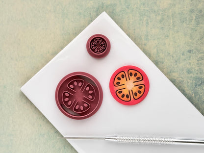 Tomato slice clay cutter showing detailed seed and segment design