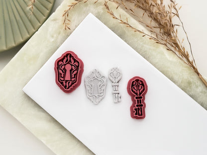 Image showing a lock and key shaped clay cutter set with polymer clay cut out samples showing the fine botanical leaf details.