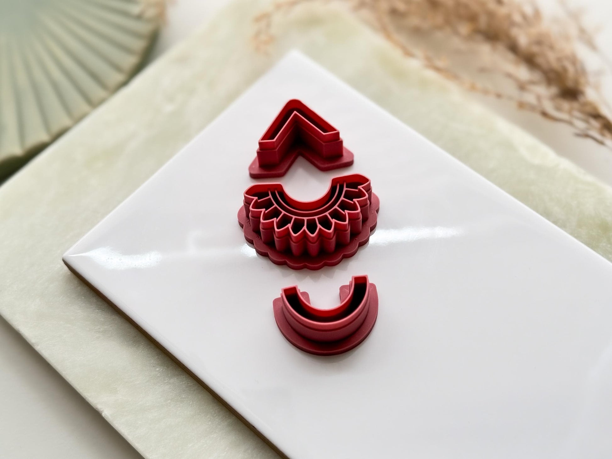 Tilted view of solace polymer clay cutter set for earring making