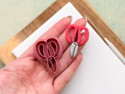 Garden scissors clay cutter – sharp imprint cutter with polymer clay sample cut out being held in a hand, made in UK by Fabled Cutters