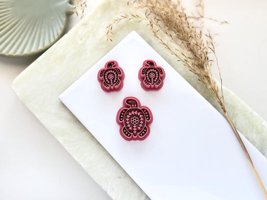 3 turtle shaped clay cutters with folk art style floral imprint patterns. This image features a single large cutter and smaller mirrored pairs for earring and jewellery making