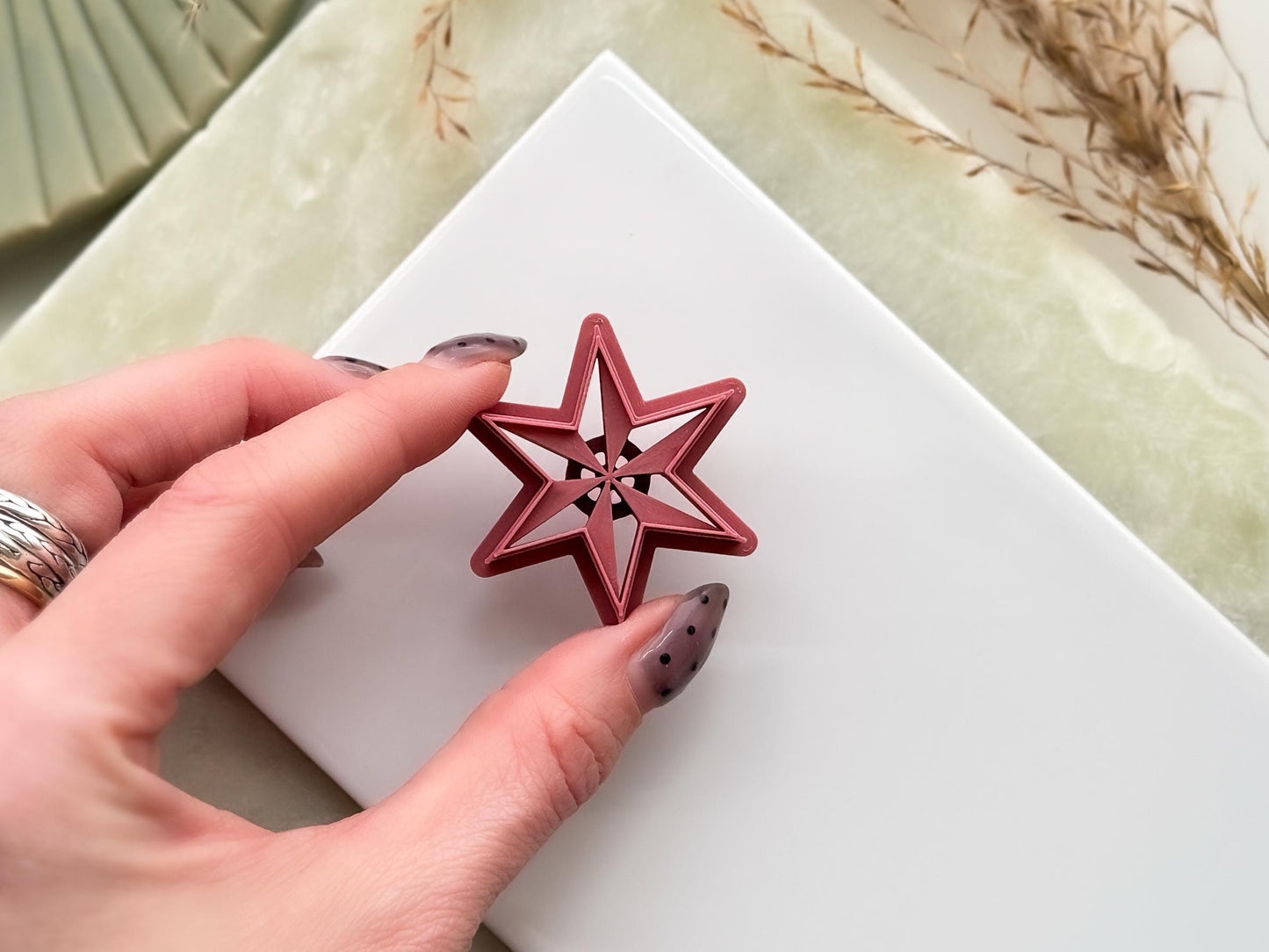 Six point star clay cutters in emo witchy style with debossed sections.