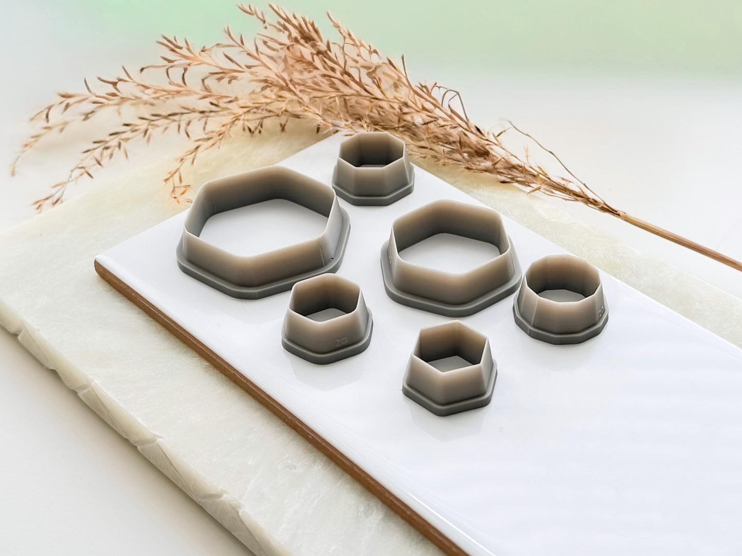 Different sizes of geometric hexagon shaped polymer clay cutters