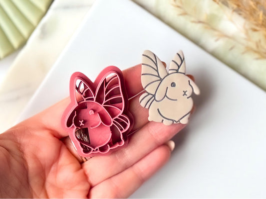 Fairy Rabbit Clay Cutter and polymer clay cut out being held in a hand
