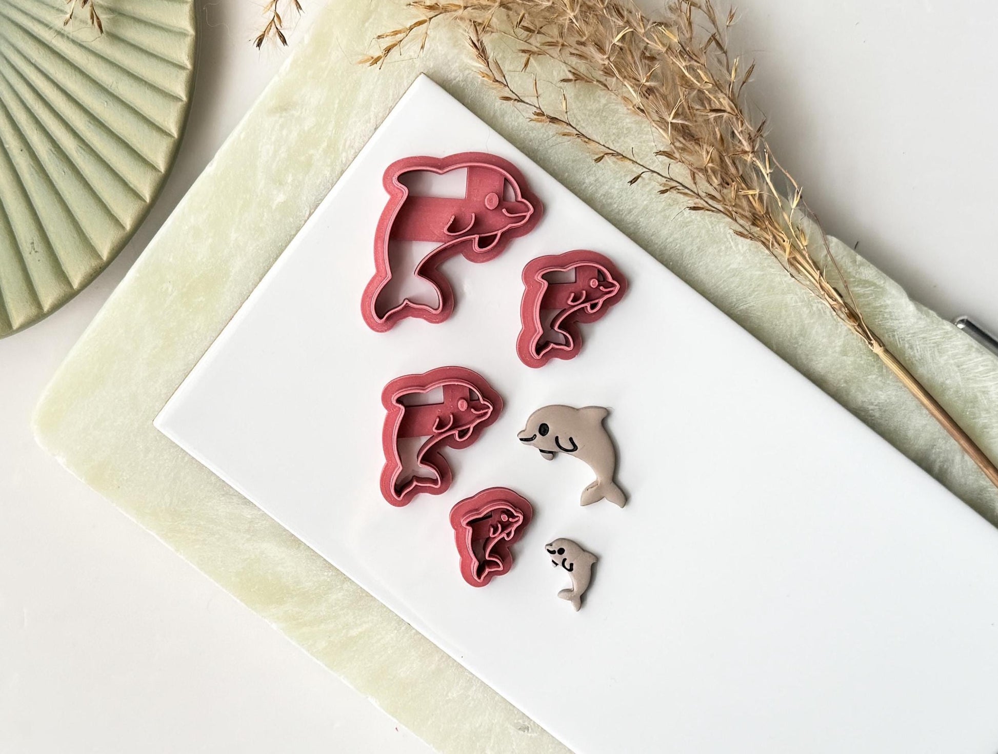 Dolphin shaped cutter in multiple colour options including food-safe white — perfect for fondant cake decorating
