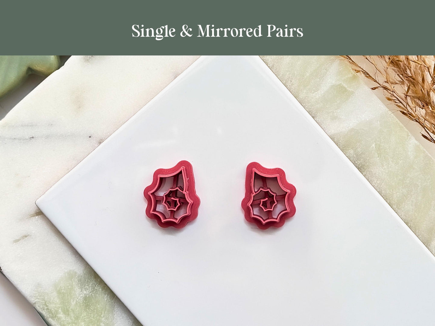 Mirrored pair of sea snail shell cutters for making polymer clay earring sets.