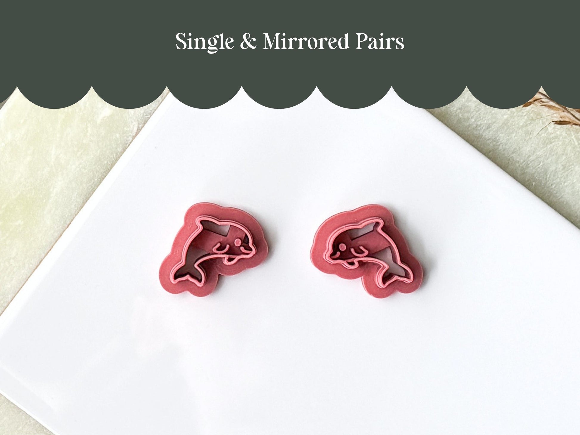Mirrored pair of dolphin shaped polymer clay cutters