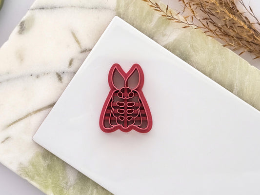 Moth polymer clay cutter with embossed insect details and sharp cutting edge. UK-made clay tool for earrings, jewellery making, fondant decoration and handmade craft projects.