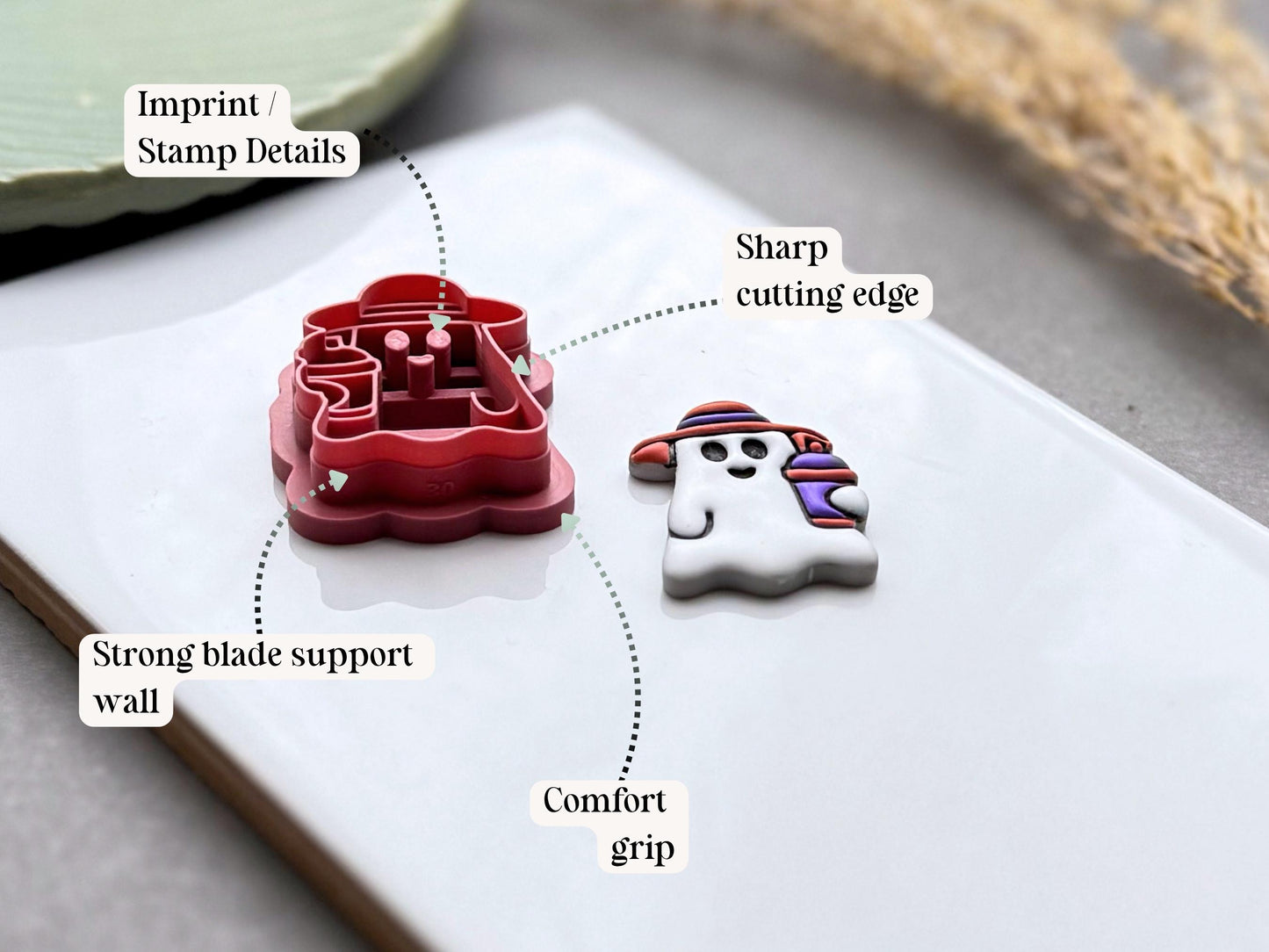 Diagram highlighting the sharp cutting edge, comfort grip, strong support wall and imprint details of a summer ghost polymer clay cutter.