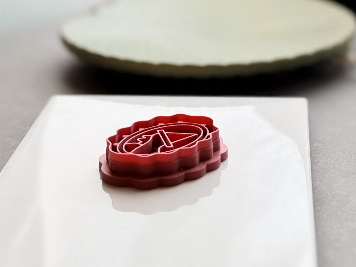 Close-up side view of a 3D printed witch hat polymer clay cutter, showing the layered construction, detailed internal cutting design, sharp cutting edge and sturdy support wall.