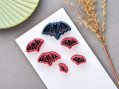 Bat polymer clay cutters displayed in multiple sizes, featuring a simple winged bat design with scalloped wings, perfect for Halloween, gothic and spooky clay projects.
