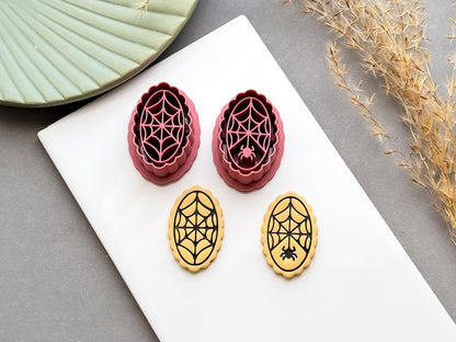 Two spider web polymer clay cutters displayed alongside matching finished clay embellishments, featuring delicate web designs with and without a small spider, perfect for Halloween, gothic and spooky clay projects.