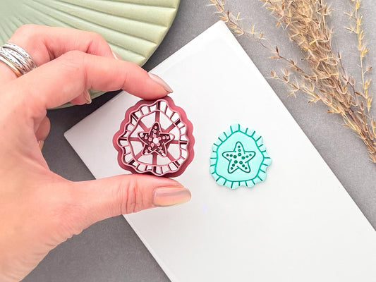 Starfish polymer clay cutter shown being held by hand, with its detailed stamp design and a finished turquoise starfish clay piece displayed alongside for comparison.