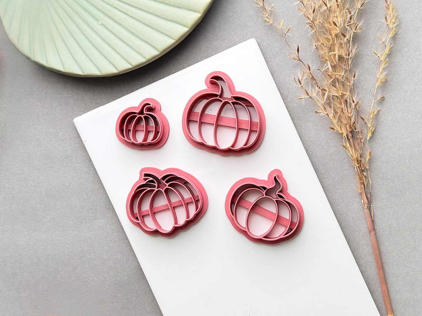 Pumpkin polymer clay cutters in four sizes, shown from above to highlight the different size options and detailed pumpkin shape.