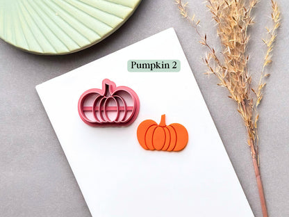 Pumpkin polymer clay cutter featuring a wide, irregular shaped pumpkin with a short stem, shown alongside a finished orange pumpkin clay piece.