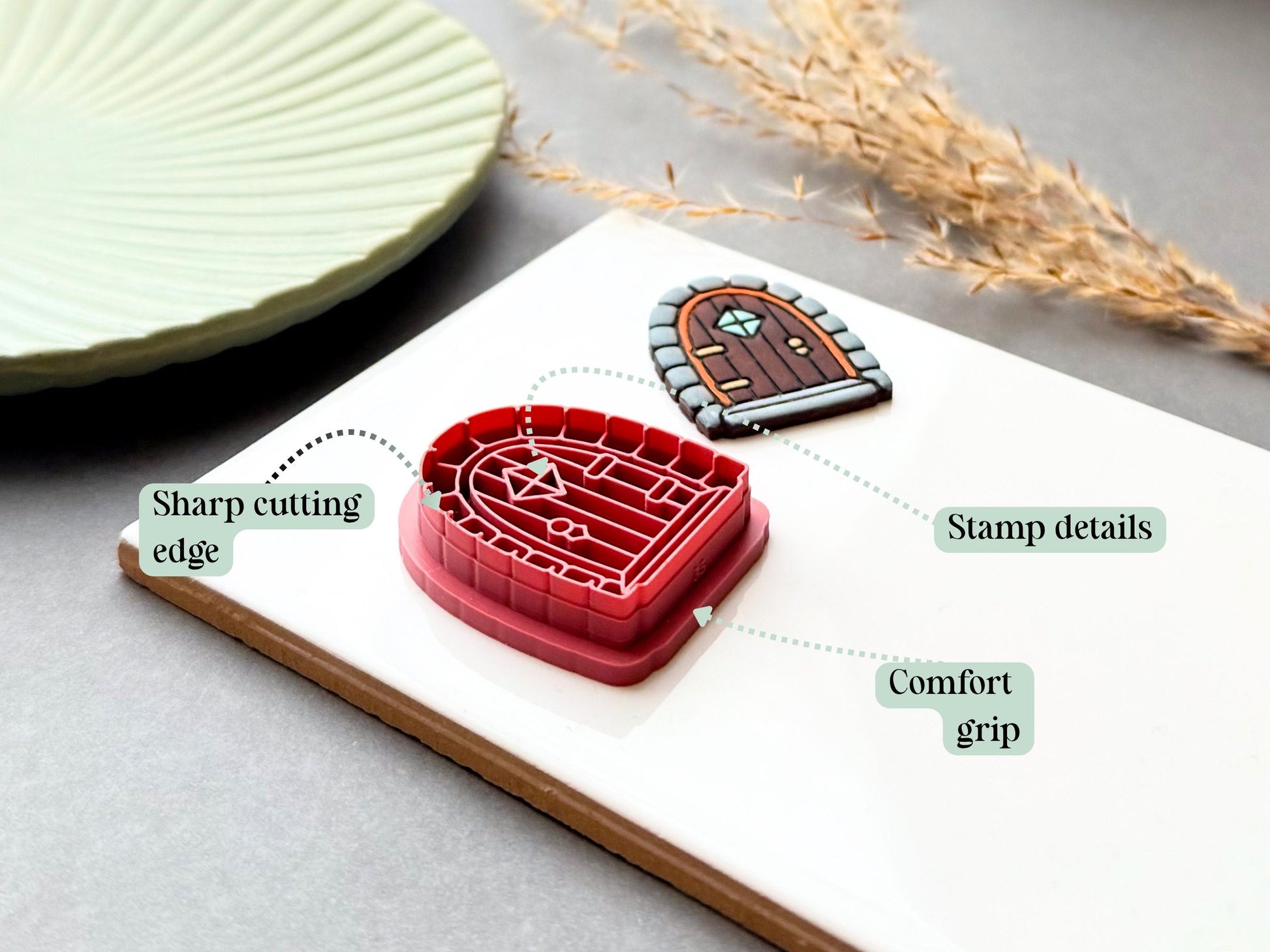 Fairy door clay cutter with labels showing a sharp cutting edge, stamp details, and comfort grip.
